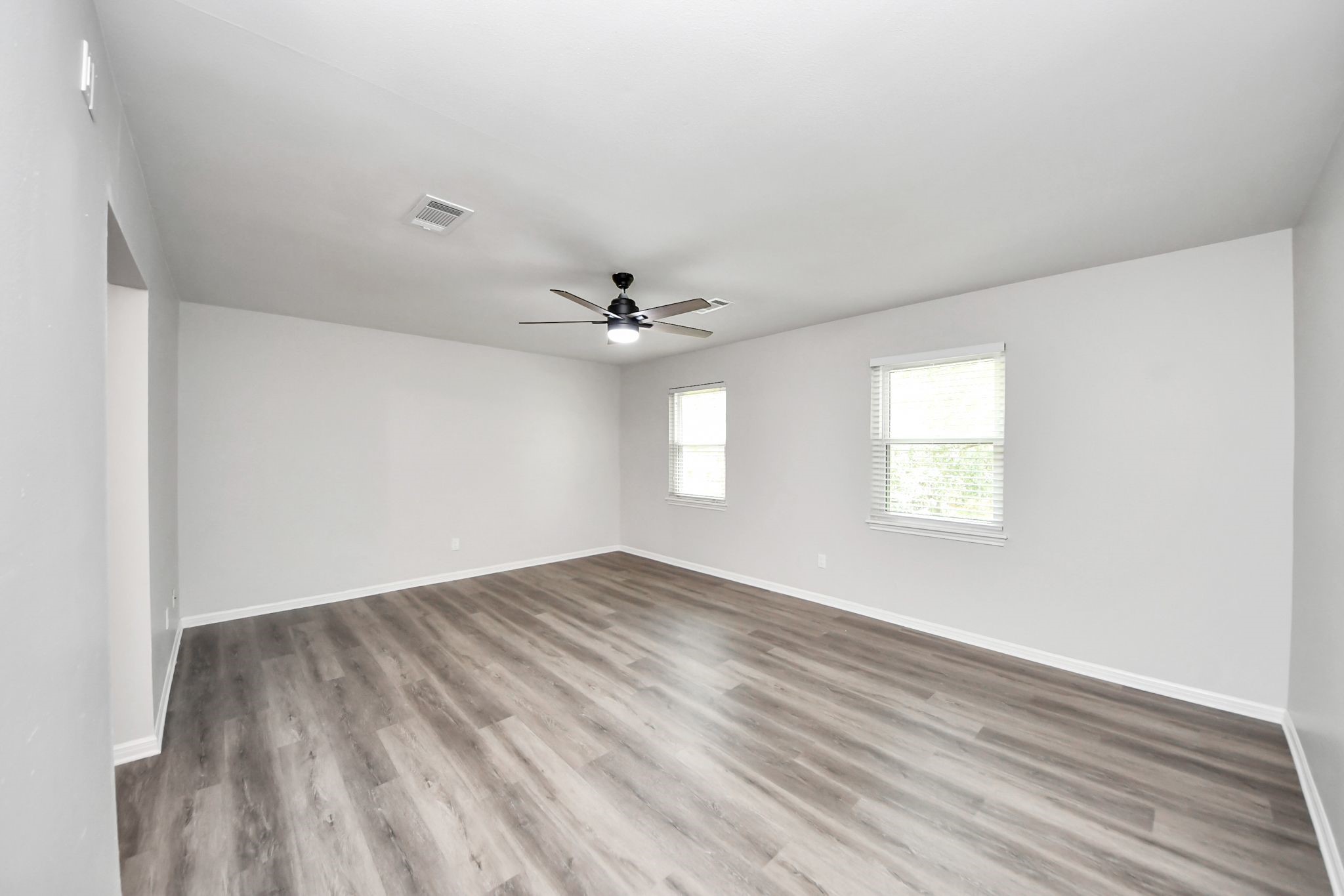 3923 Cypress Lake Drive Spring, TX 77388 - Photo 23 of 48 wooden floor in an empty room with a window