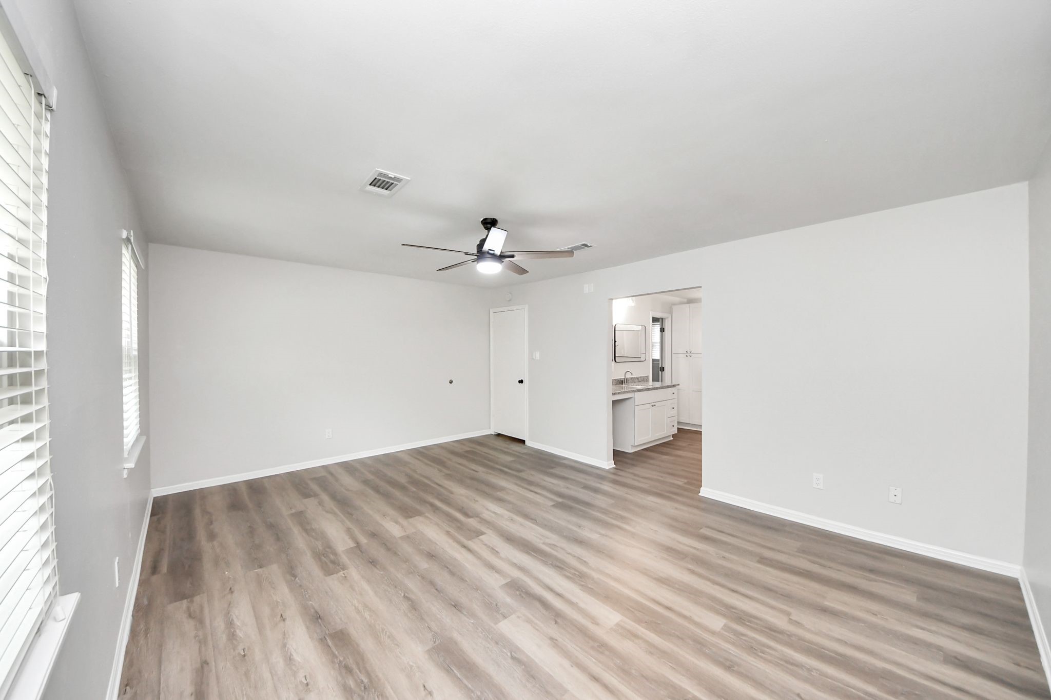 3923 Cypress Lake Drive Spring, TX 77388 - Photo 23 of 41 Master Bedroom with beautiful new flooring leading to Bathroom En Suite.
