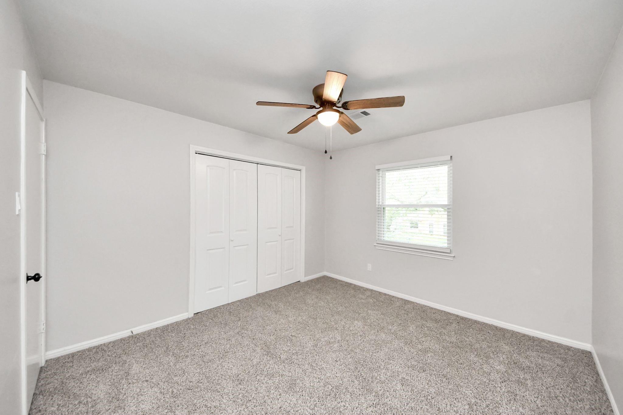 3923 Cypress Lake Drive Spring, TX 77388 - Photo 33 of 48 a view of a room with a ceiling fan and a window