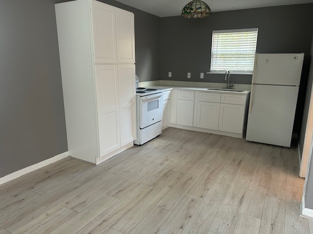 3923 Cypress Lake Drive Spring, TX 77388 - Photo 40 of 48 a kitchen with white cabinets and white appliances