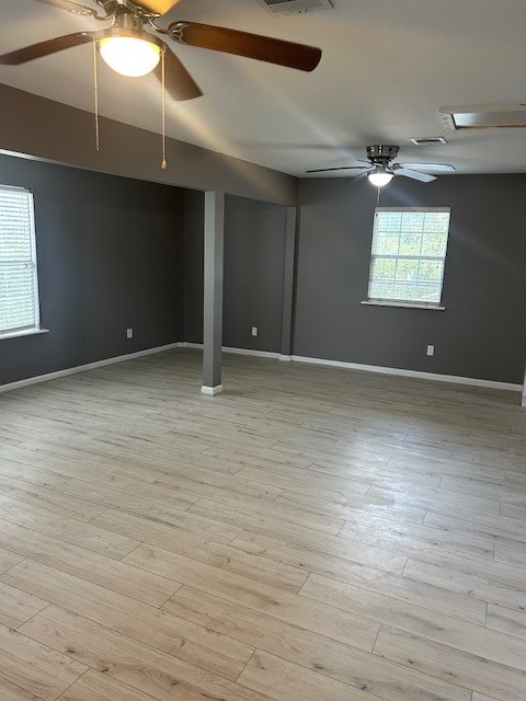 3923 Cypress Lake Drive Spring, TX 77388 - Photo 44 of 48 an empty room with wooden floor ceiling fan and windows
