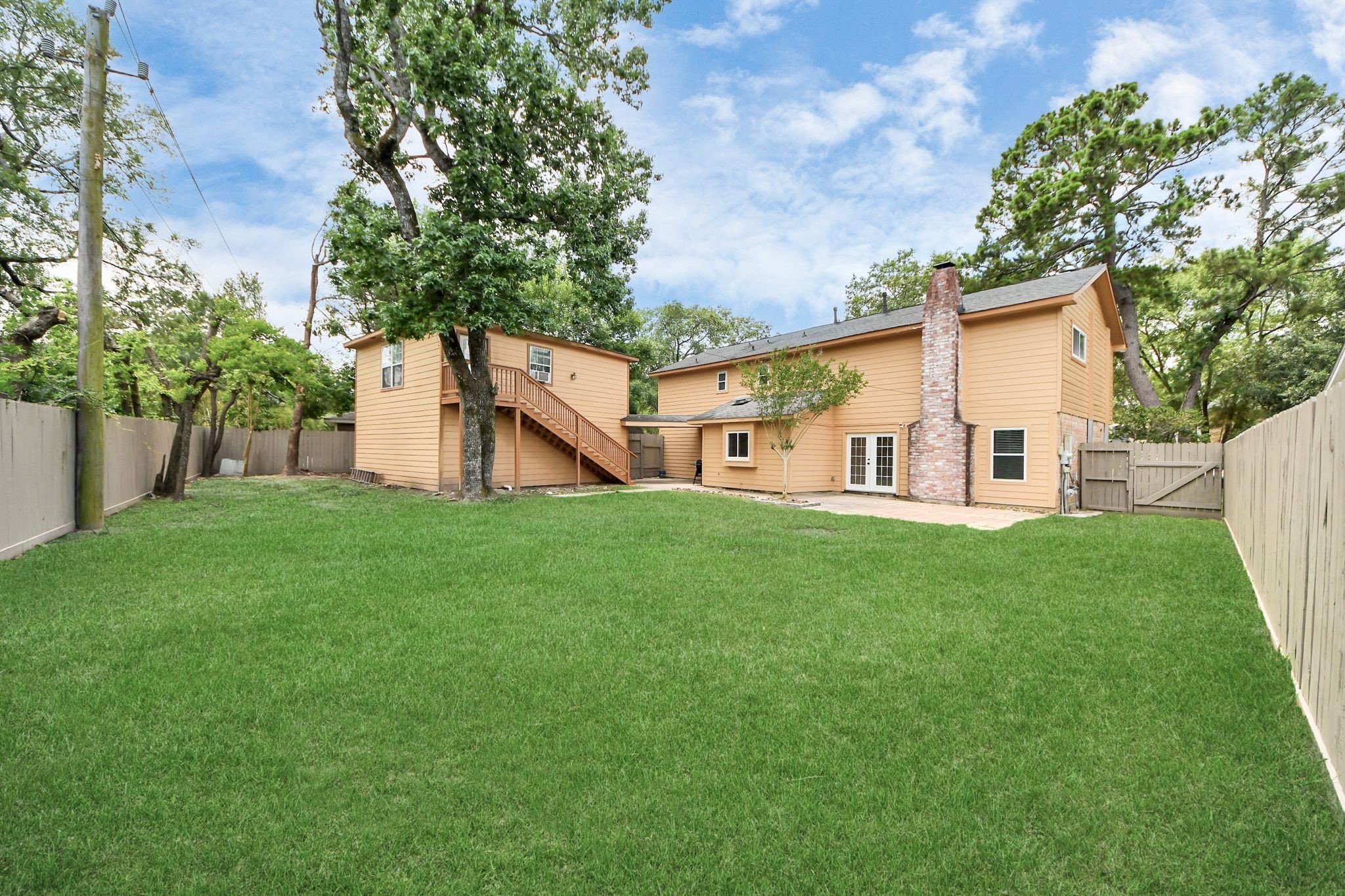 3923 Cypress Lake Drive Spring, TX 77388 - Photo 47 of 48 a view of a house with backyard and a tree