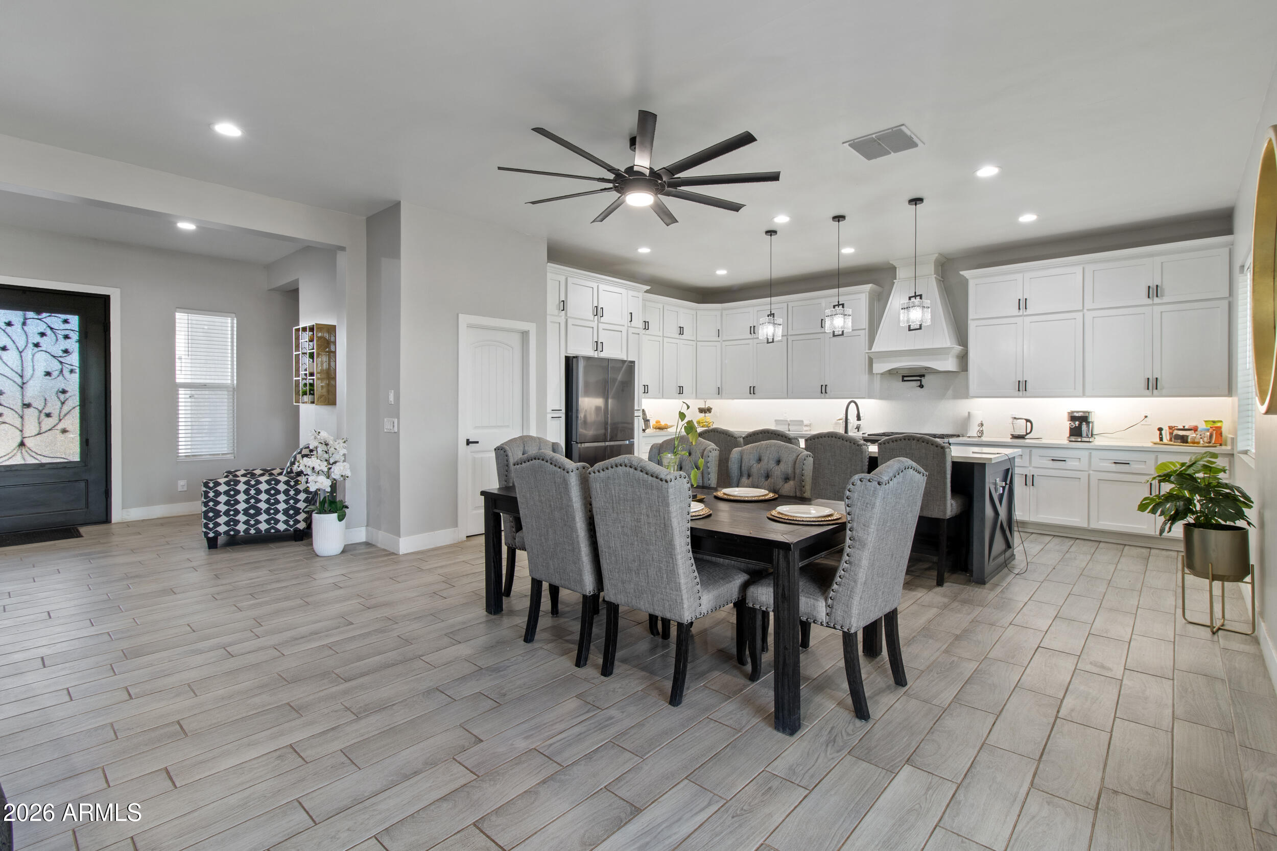 22531 West Harwell Road Buckeye, AZ 85326 - Photo 14 of 40 a view of a dining room with furniture and wooden floor