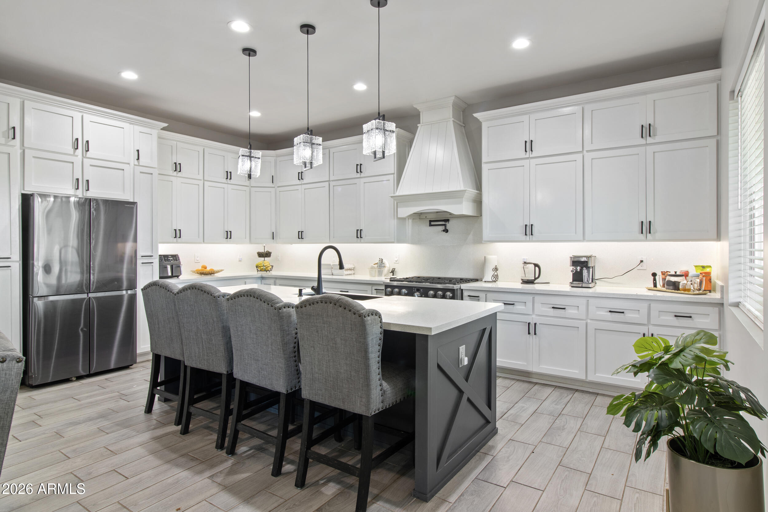 22531 West Harwell Road Buckeye, AZ 85326 - Photo 16 of 40 a large kitchen with lots of counter space and appliances