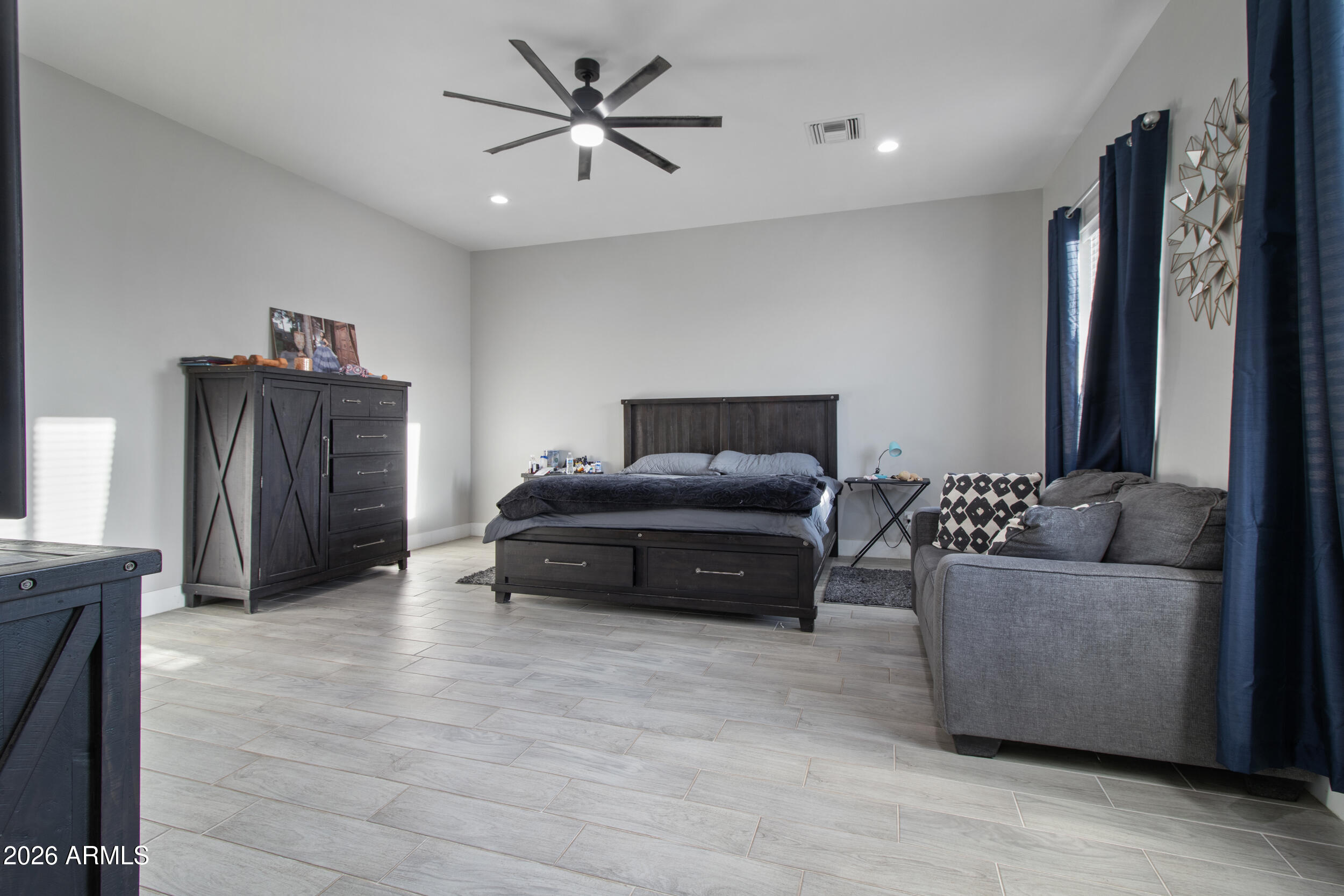 22531 West Harwell Road Buckeye, AZ 85326 - Photo 20 of 40 a living room with furniture and a flat screen tv