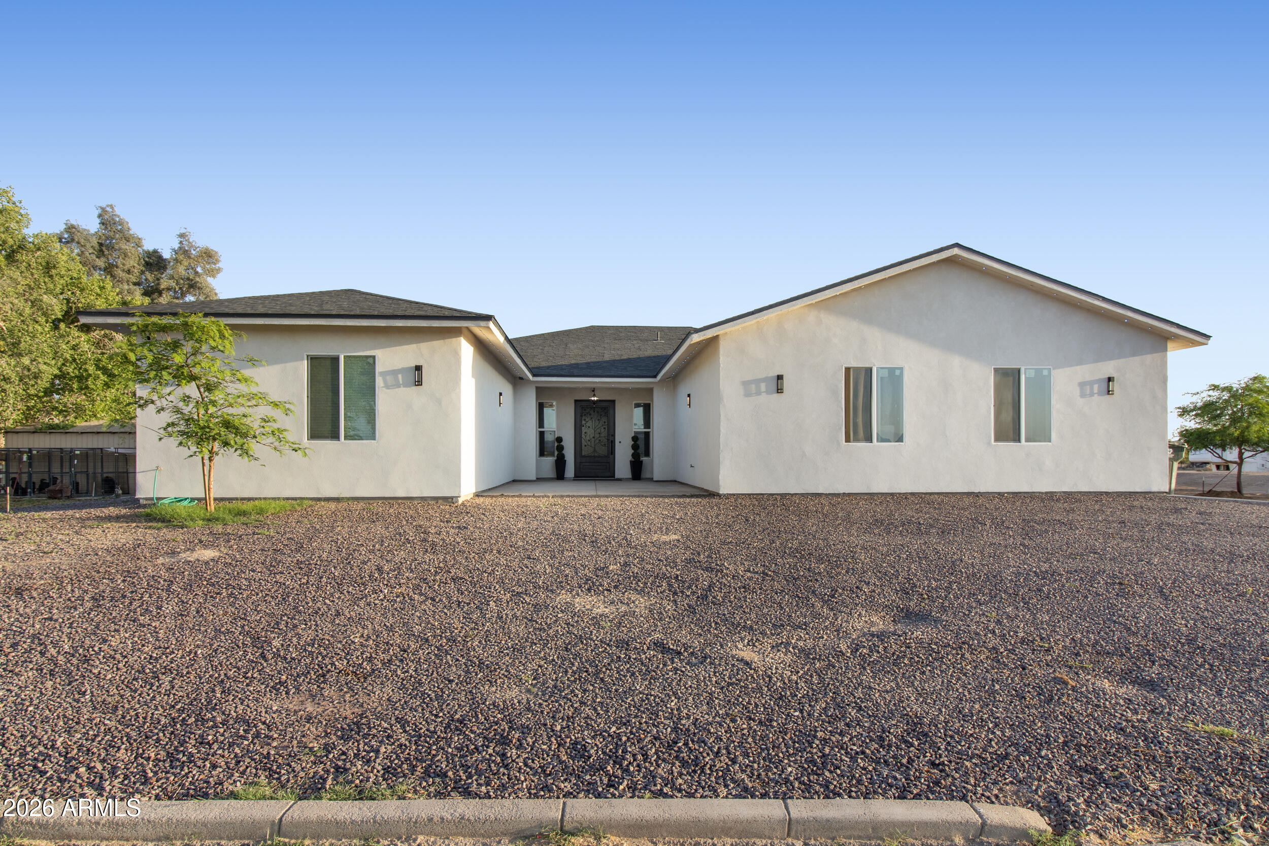 22531 West Harwell Road Buckeye, AZ 85326 - Photo 2 of 40 a view of a house with a yard