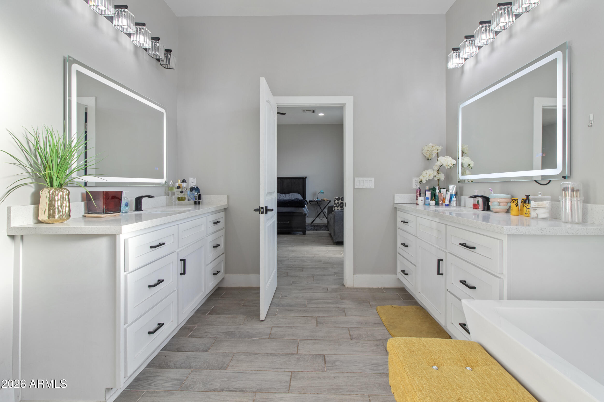 22531 West Harwell Road Buckeye, AZ 85326 - Photo 23 of 40 a bathroom with a tub sink and mirror