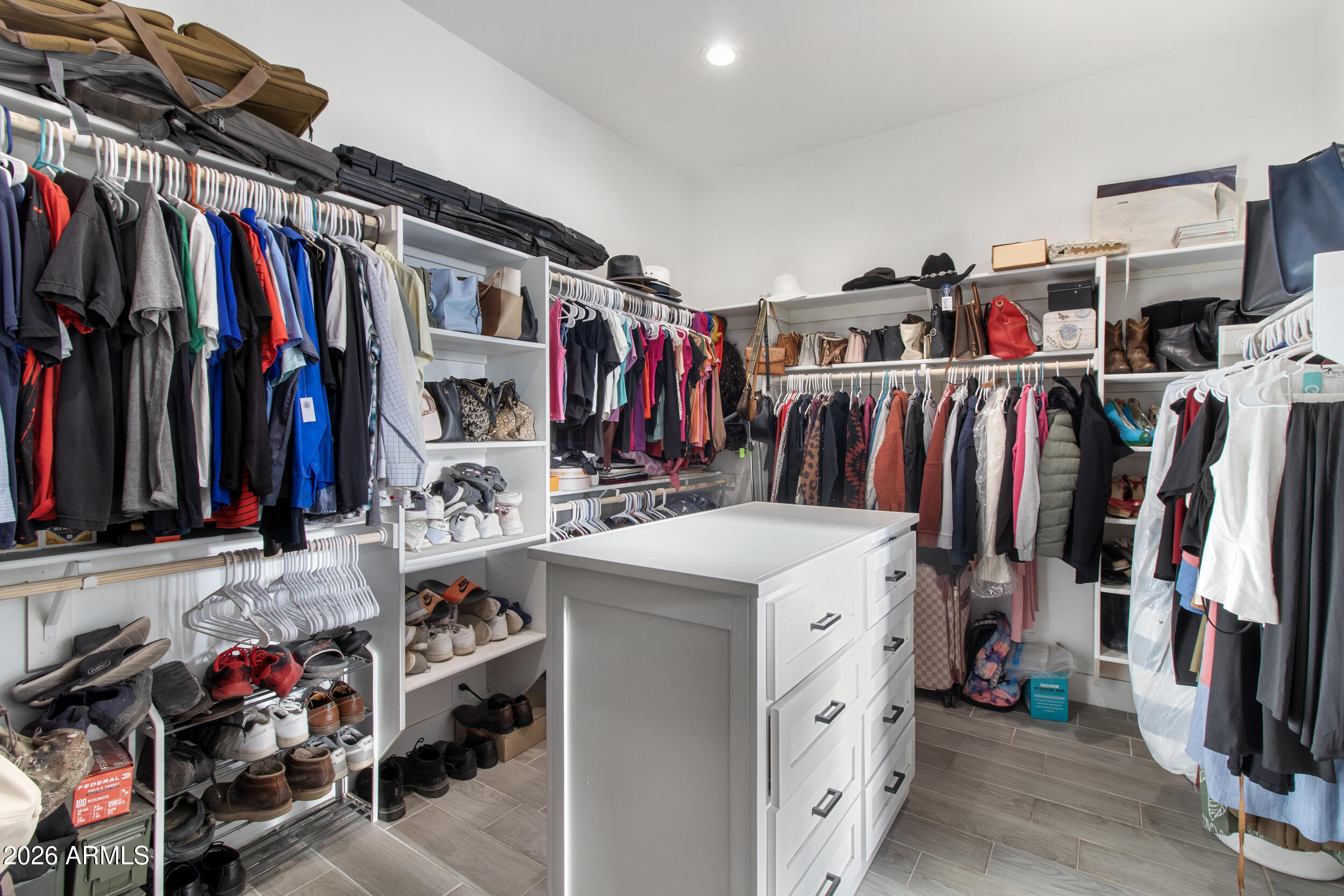 22531 West Harwell Road Buckeye, AZ 85326 - Photo 24 of 40 a view of walk in closet with clothes