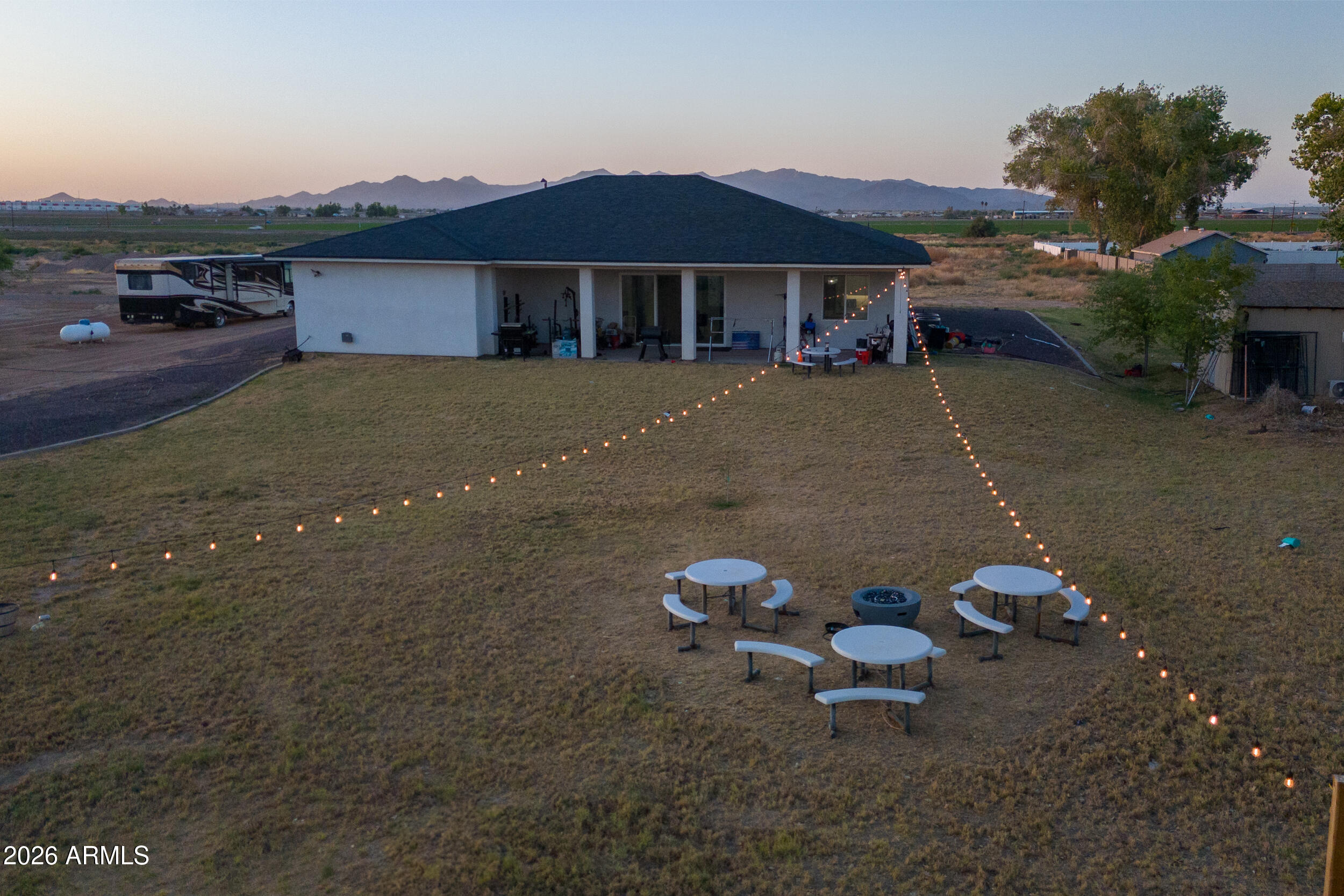 22531 West Harwell Road Buckeye, AZ 85326 - Photo 37 of 40 a backyard of a house with table and chairs