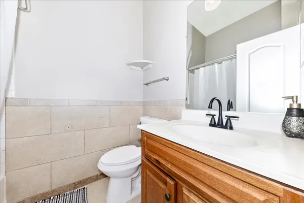 a balcony with furniture and wooden floor