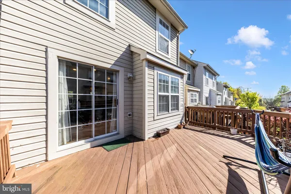 a view of balcony with deck and wooden fence
