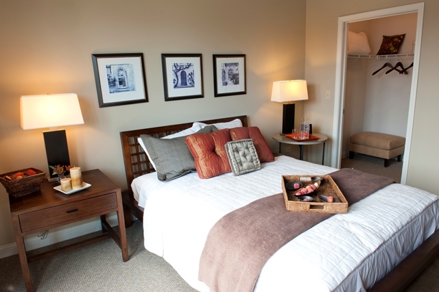 1801 Tower Drive, Unit E243 Glenview, IL 60026 - Photo 13 of 26 a bedroom with a bed and wooden floor