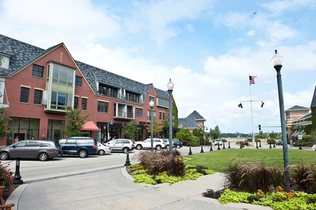 1801 Tower Drive, Unit E243 Glenview, IL 60026 - Photo 24 of 26 a city street lined with tall buildings and a yard