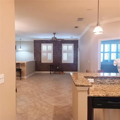 a view of a kitchen and granite countertop sink