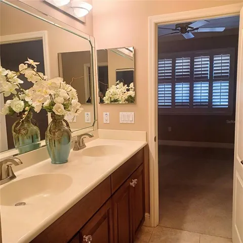 a bathroom with a sink and mirror