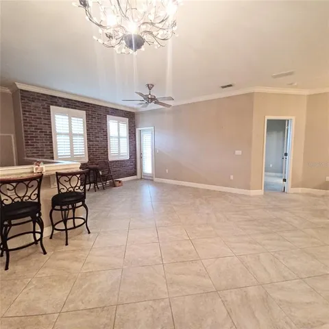 a view of a livingroom with furniture and chandelier