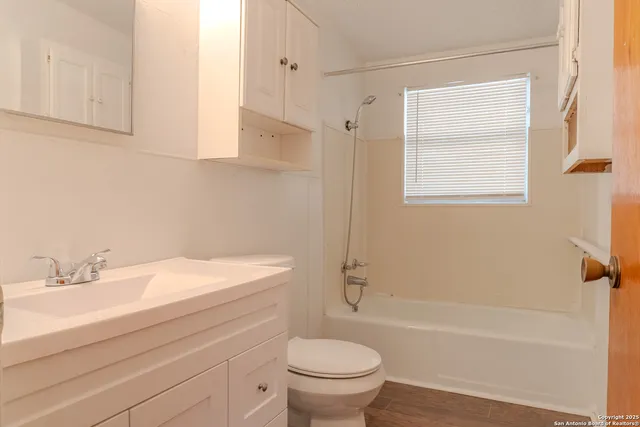 a bathroom with a sink a toilet and a bathtub