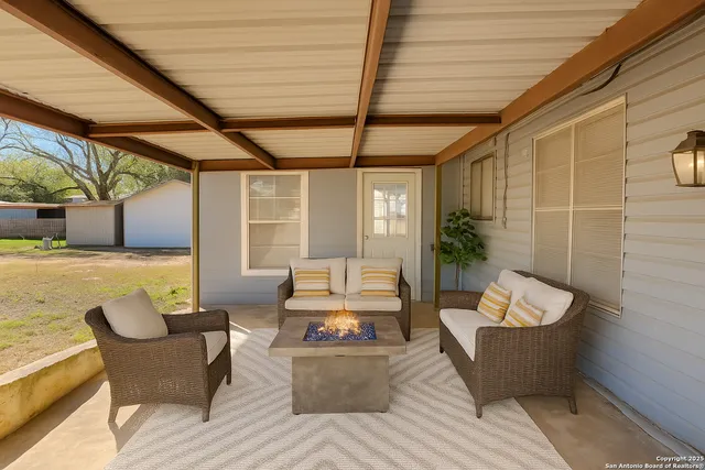 a outdoor living space with furniture and a potted plant