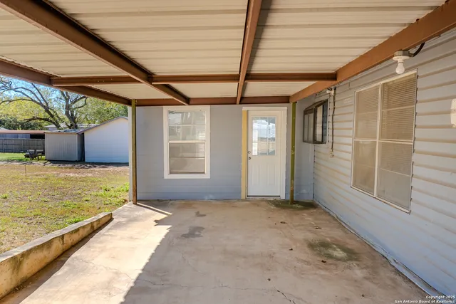 a view of a room with window and furniture