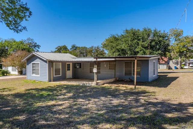 a house with trees in the background