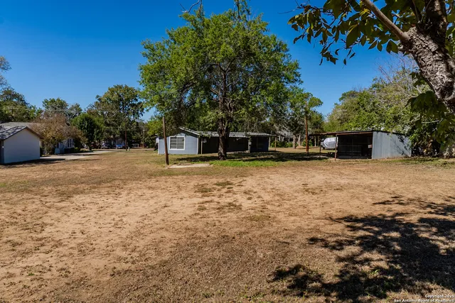 a house with trees in the background