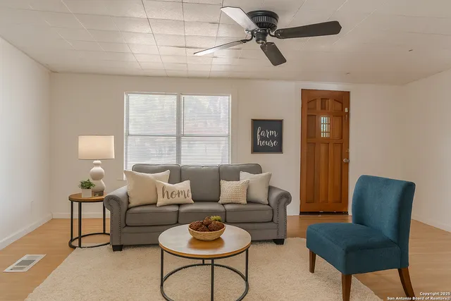 a living room with furniture and a window