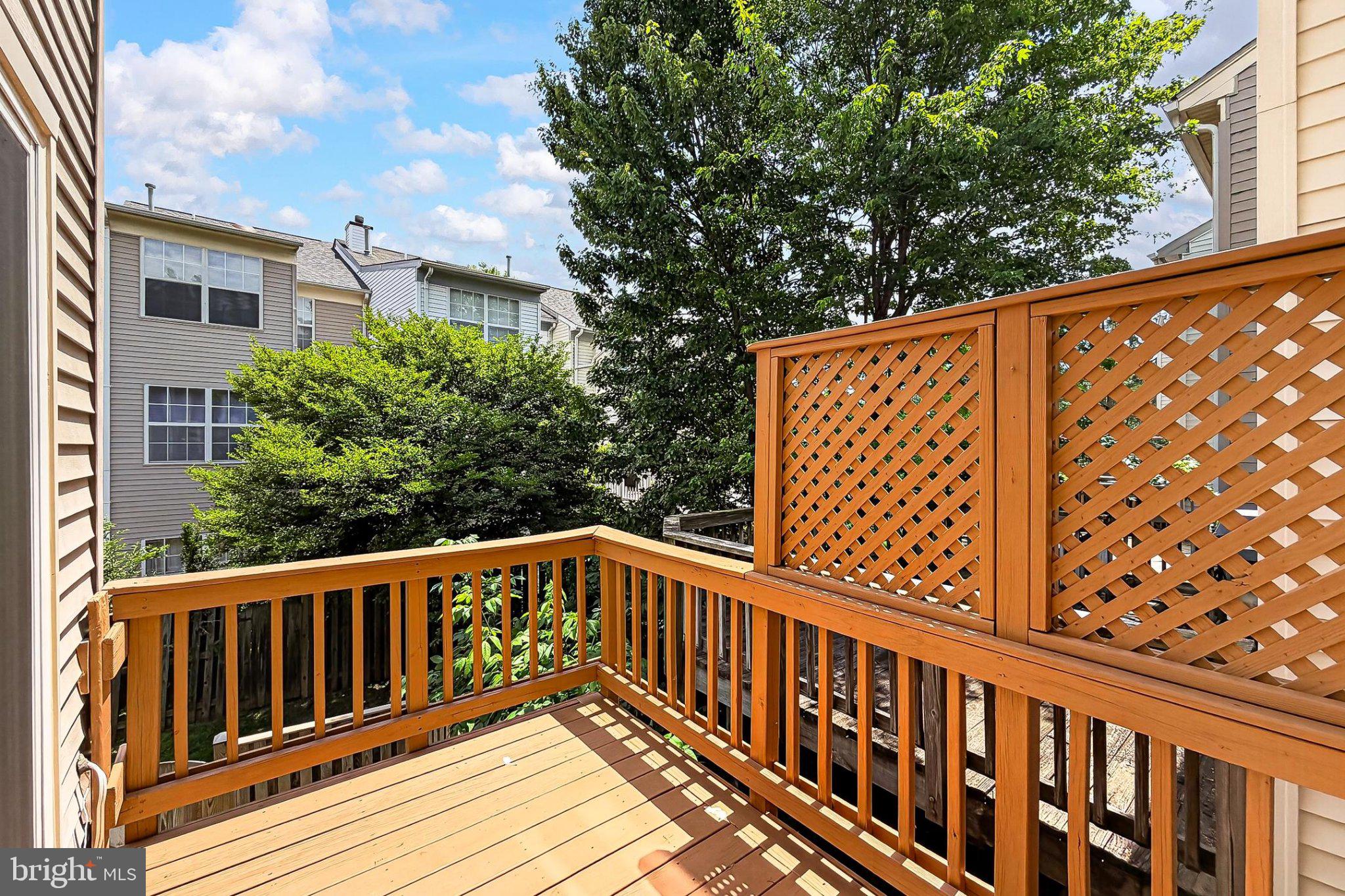 13157 Kidwell Field Road Herndon, VA 20171 - Photo 40 of 50 Sunny deck with lush greenery view.