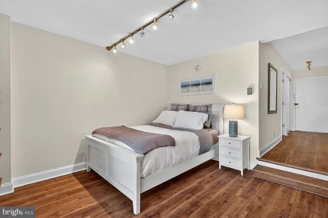 a room with a bed and a night stand