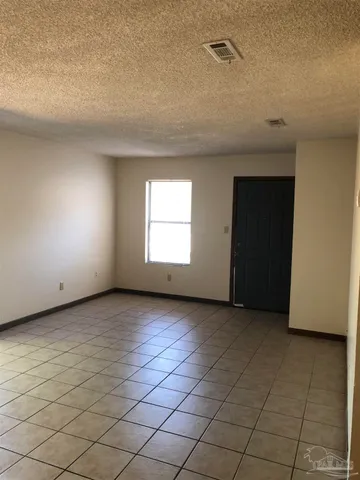 a kitchen with a refrigerator sink and cabinets
