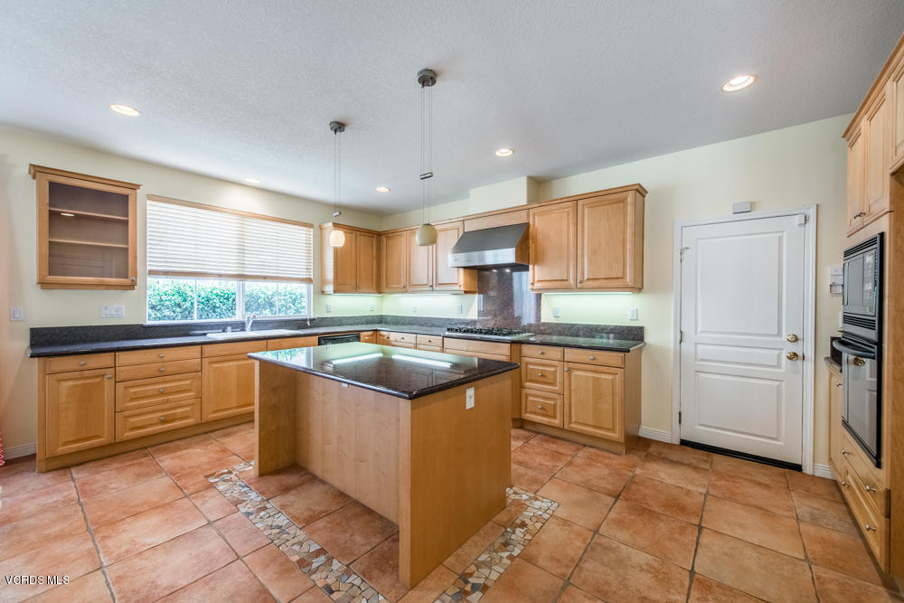 277 Knoll Ridge Road Simi Valley, CA 93065 - Photo 15 of 37 a kitchen with stainless steel appliances granite countertop a refrigerator and a sink
