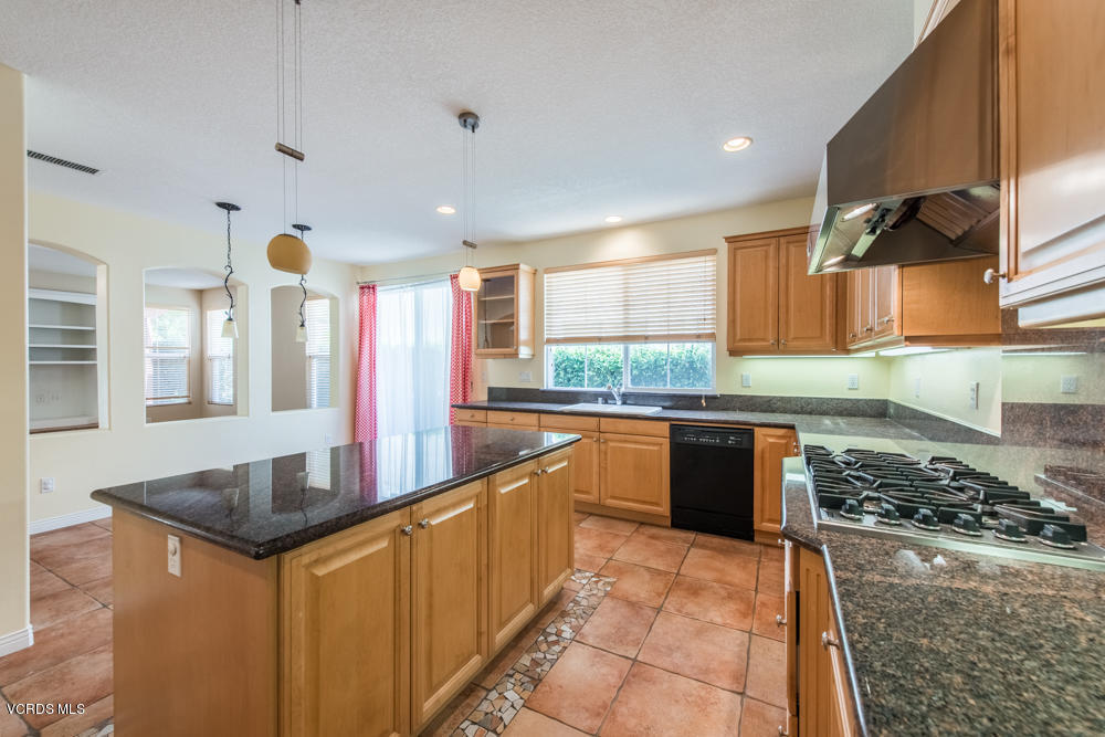 277 Knoll Ridge Road Simi Valley, CA 93065 - Photo 17 of 37 a kitchen with stainless steel appliances granite countertop a sink stove and cabinets