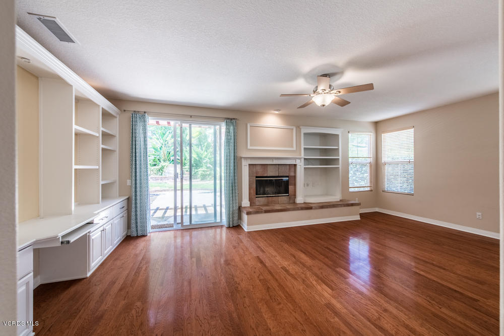 277 Knoll Ridge Road Simi Valley, CA 93065 - Photo 18 of 37 a view of an empty room with wooden floor and a window