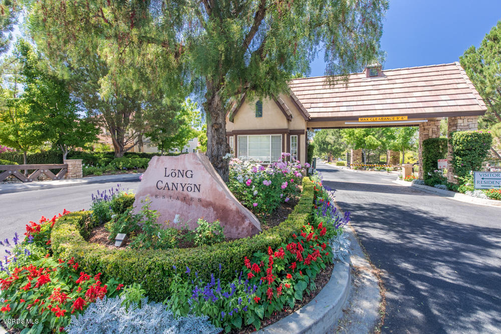 277 Knoll Ridge Road Simi Valley, CA 93065 - Photo 3 of 37 a front view of a house with a yard and fountain
