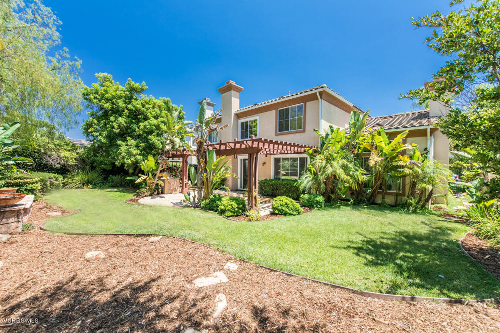 277 Knoll Ridge Road Simi Valley, CA 93065 - Photo 35 of 37 a front view of a house with a yard and garage