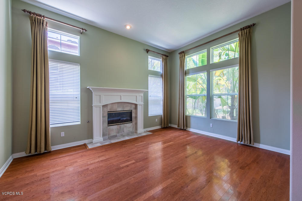 277 Knoll Ridge Road Simi Valley, CA 93065 - Photo 9 of 37 a view of an empty room with a window and a fireplace