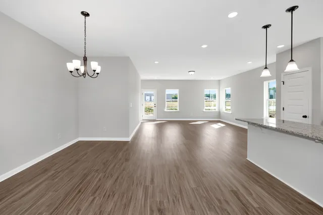 a view of a room with window and wooden floor