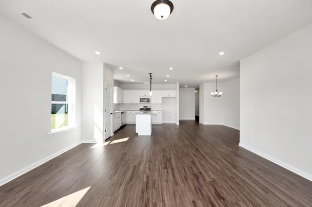 a view of kitchen and wooden floor