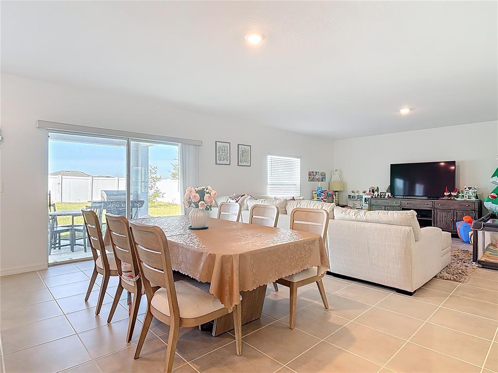 1146 Calico Pointe Circle Groveland, FL 34736 - Photo 19 of 54 a view of a dining room with furniture and a livingroom