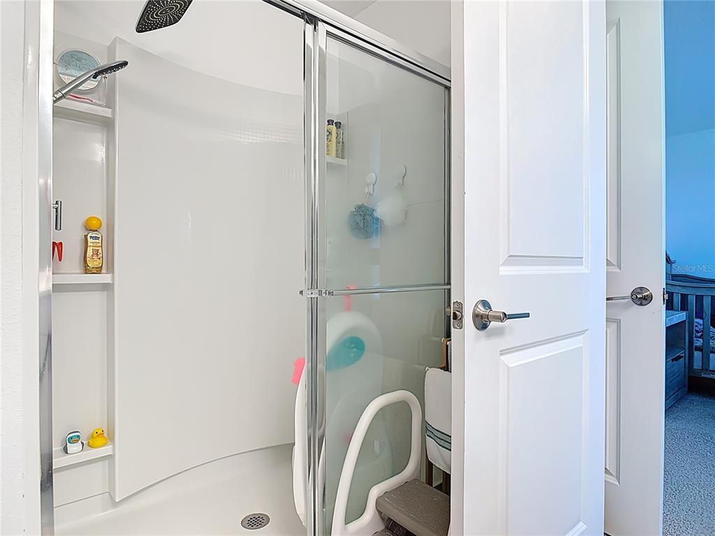 1146 Calico Pointe Circle Groveland, FL 34736 - Photo 26 of 54 a bathroom with a bathtub and a shower