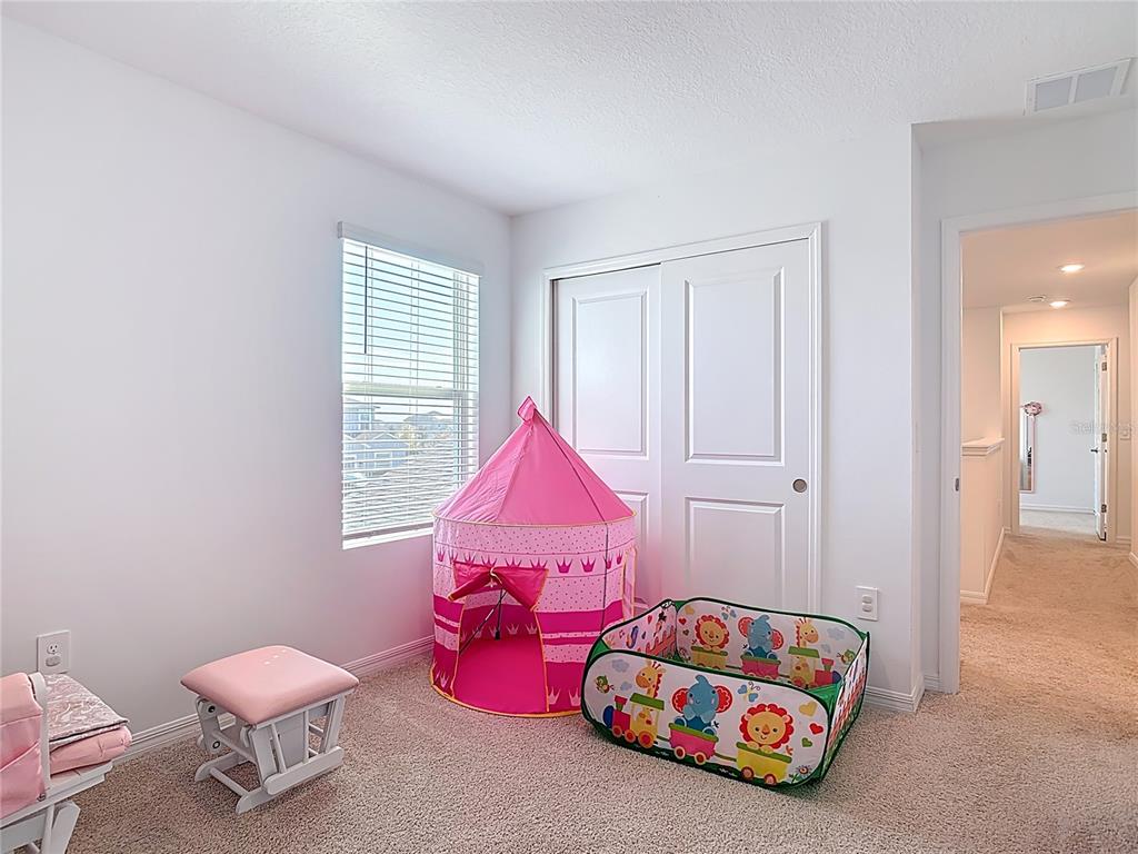 1146 Calico Pointe Circle Groveland, FL 34736 - Photo 30 of 54 a bedroom with a bed and a window