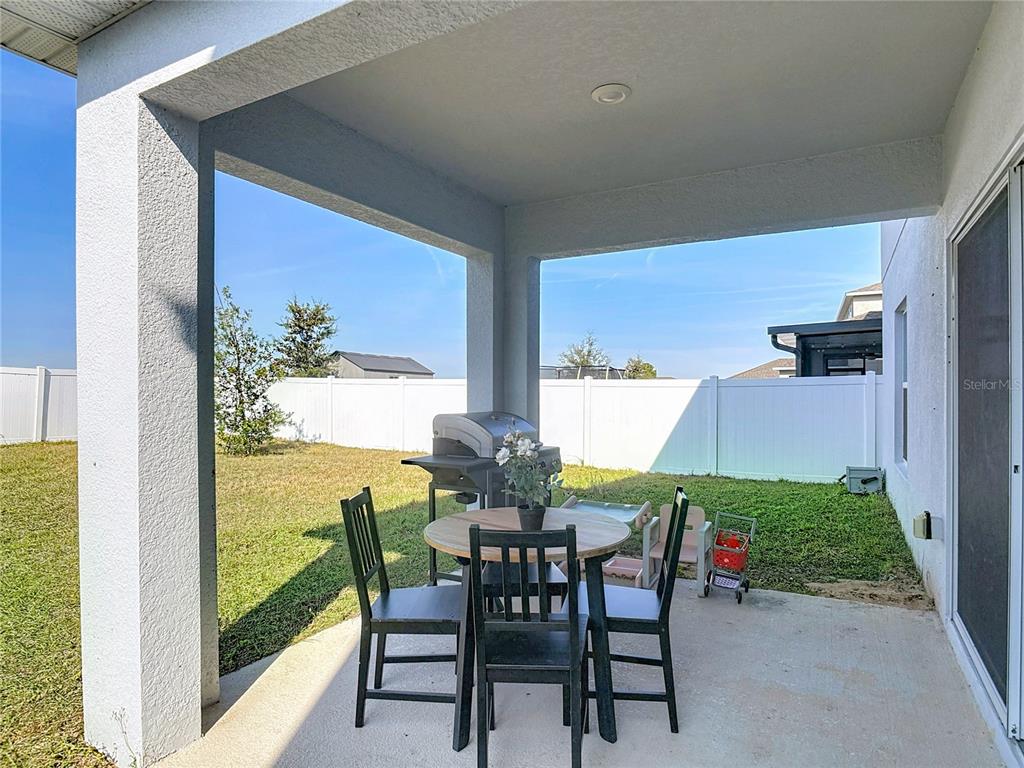 1146 Calico Pointe Circle Groveland, FL 34736 - Photo 41 of 54 a view of an chairs and table in the patio