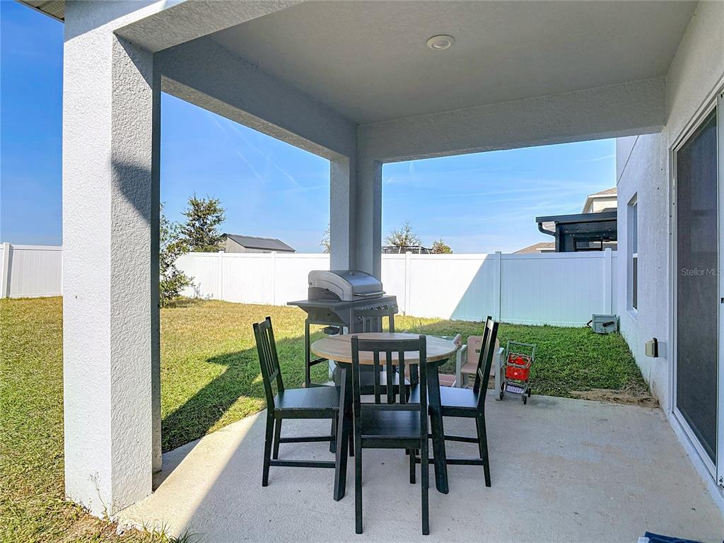 1146 Calico Pointe Circle Groveland, FL 34736 - Photo 42 of 54 a view of an outdoor dining space with furniture