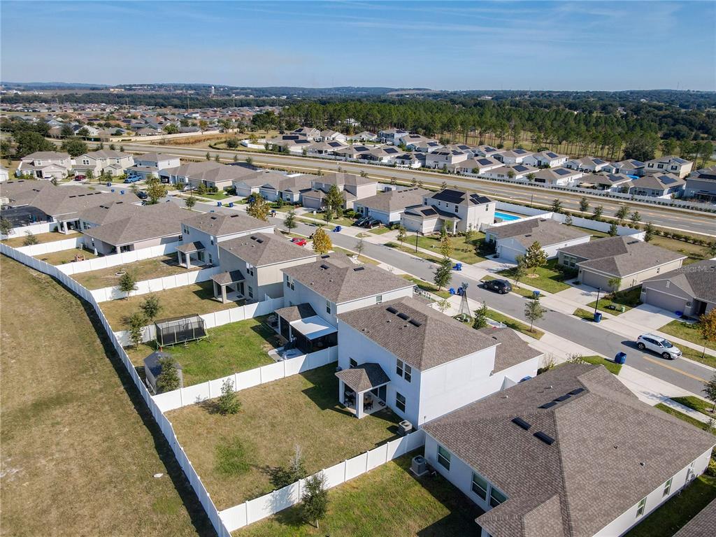 1146 Calico Pointe Circle Groveland, FL 34736 - Photo 51 of 54 an aerial view of a house with a garden