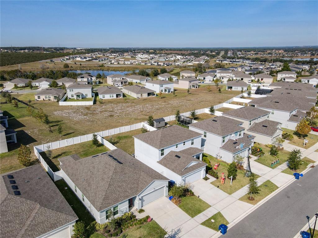 1146 Calico Pointe Circle Groveland, FL 34736 - Photo 52 of 54 an aerial view of residential houses with outdoor space