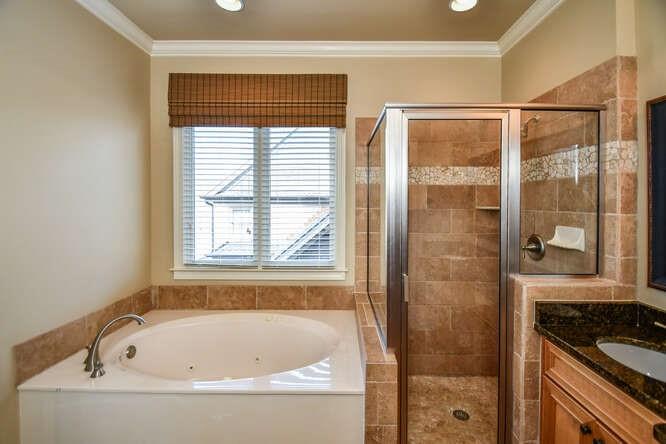 4814 Amal Lane Gainesville, GA 30506 - Photo 14 of 40 a bathroom with a bathtub and shower