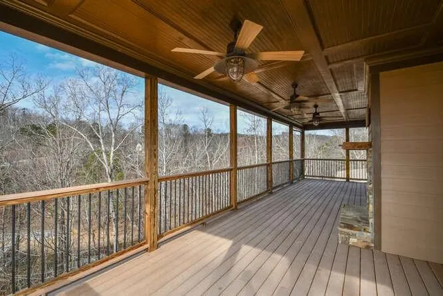 a view of a balcony with wooden floor