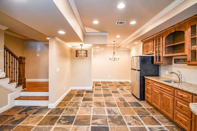 a picture of a kitchen with stainless steel appliances and cabinets