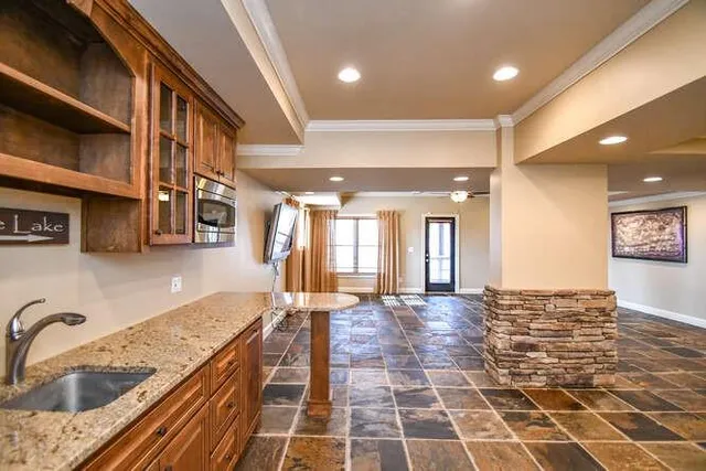 a lobby with a couch and a rug