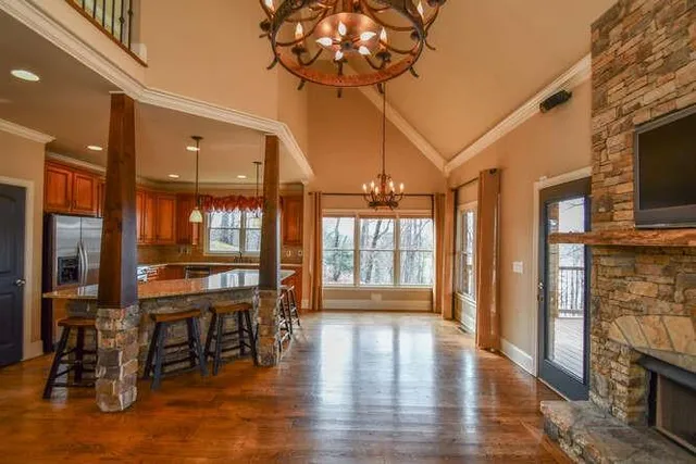 a view of a livingroom with furniture window and wooden floor