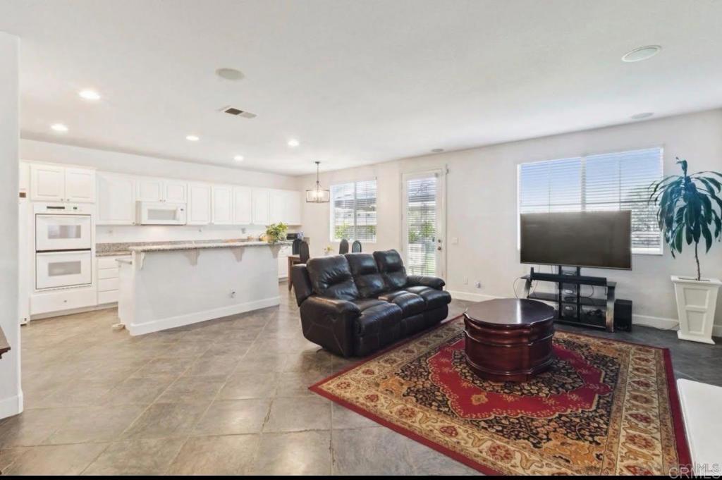 1234 Old Janal Ranch Road Chula Vista, CA 91915 - Photo 16 of 34 a living room with furniture and a flat screen tv